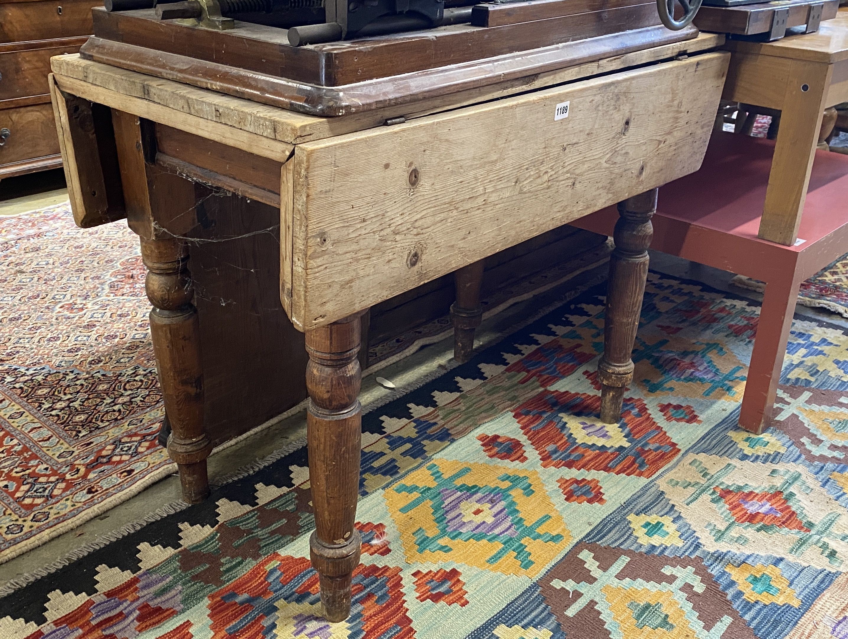 A Victorian stripped pine drop flap kitchen table, width 96cm, depth 49cm, height 74cm